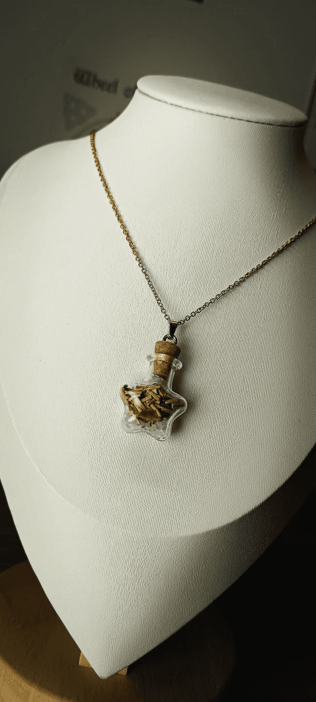 Pendentif fiole Lumière dans l&#039;obscurité doré